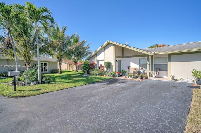 view of property exterior featuring a lawn