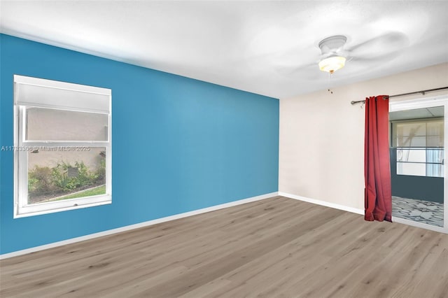 spare room featuring light hardwood / wood-style floors