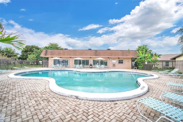 view of swimming pool featuring a patio area