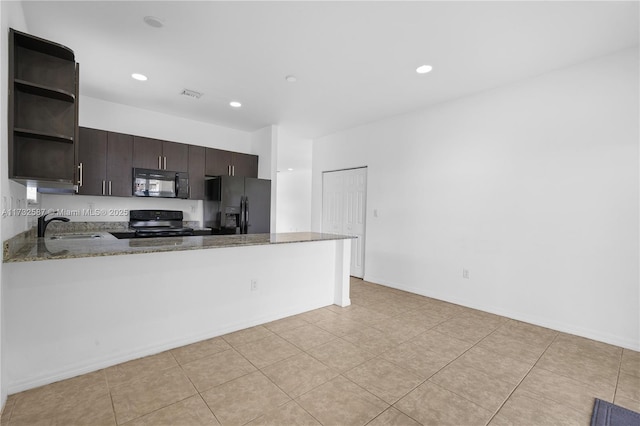 kitchen featuring black appliances, sink, light stone counters, kitchen peninsula, and dark brown cabinets