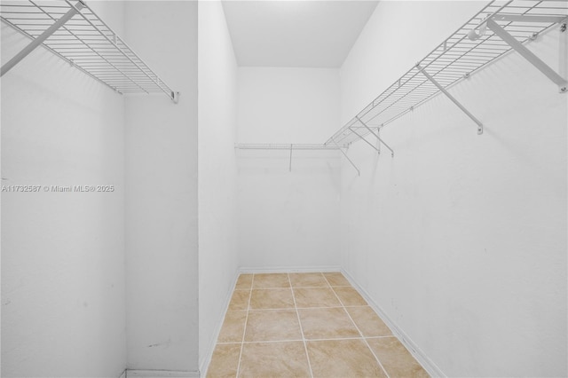 spacious closet with tile patterned flooring