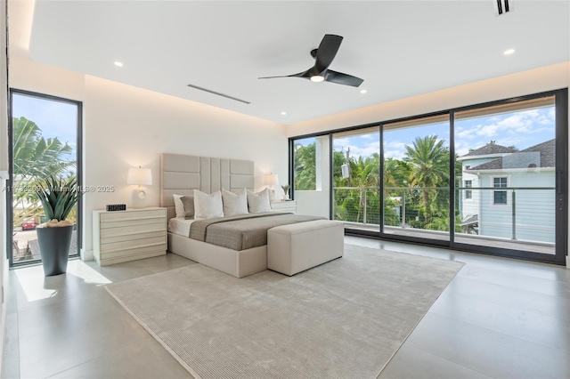 bedroom featuring multiple windows and ceiling fan