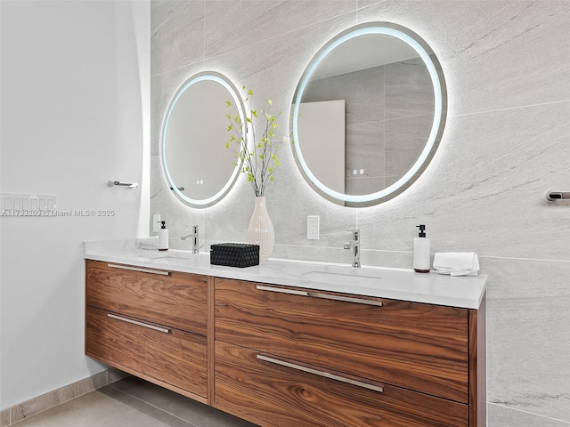 bathroom with tile patterned flooring and vanity