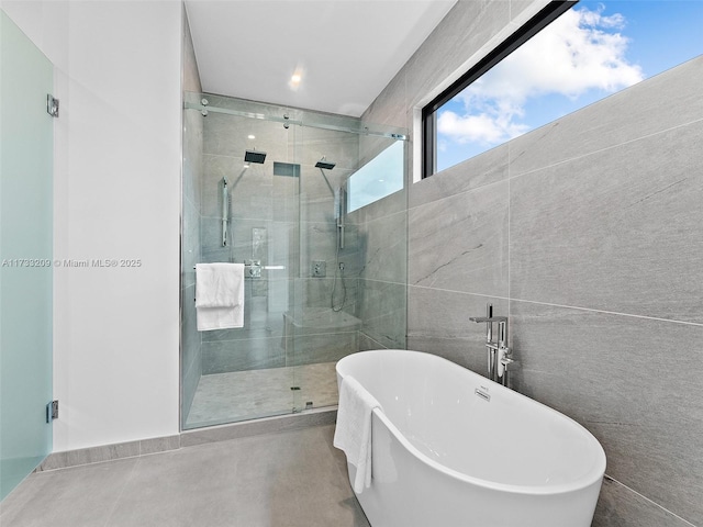 bathroom with shower with separate bathtub