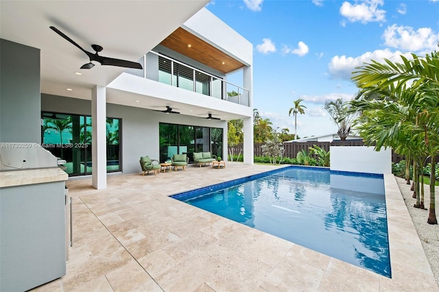 view of pool with area for grilling, an outdoor hangout area, a patio, and ceiling fan