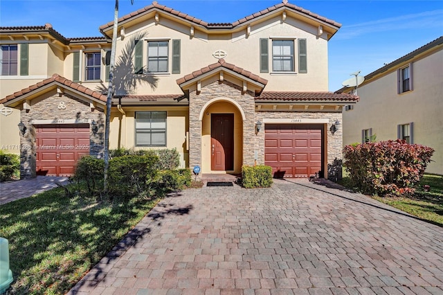 mediterranean / spanish-style house featuring a garage