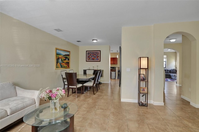 living room with light tile patterned flooring