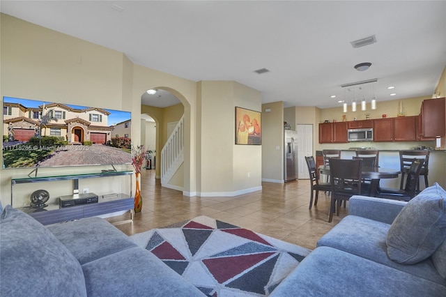 living room with light tile patterned floors