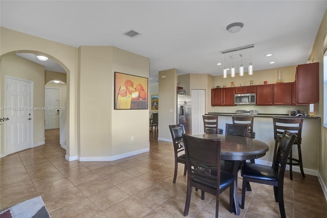 dining space with light tile patterned floors