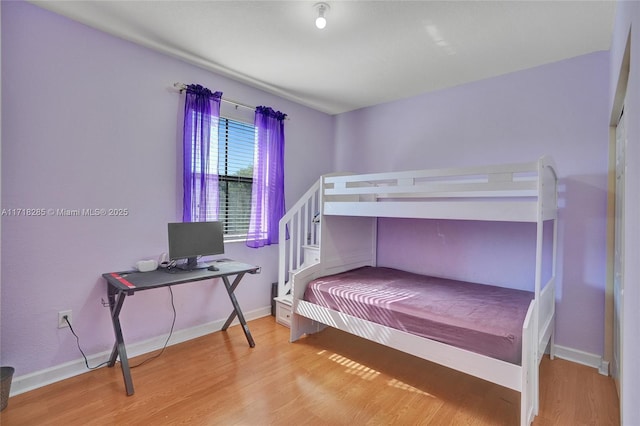 bedroom with light wood-type flooring