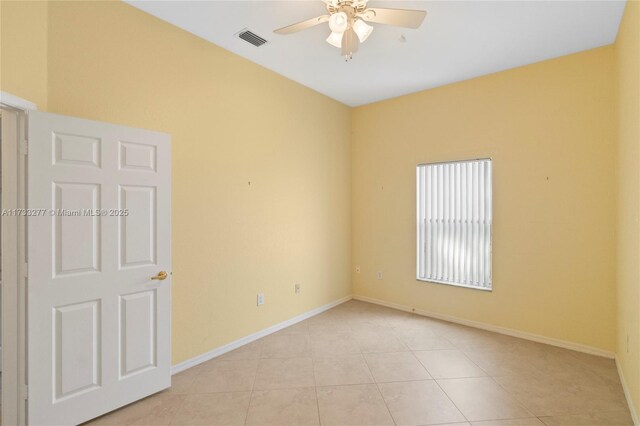 unfurnished room featuring light tile patterned floors and ceiling fan