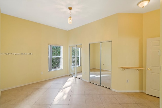 unfurnished bedroom featuring light tile patterned floors