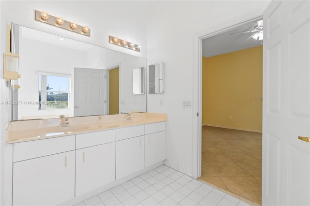 bathroom with tile patterned flooring, vanity, and ceiling fan