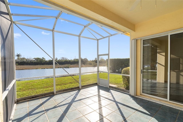 unfurnished sunroom with a water view