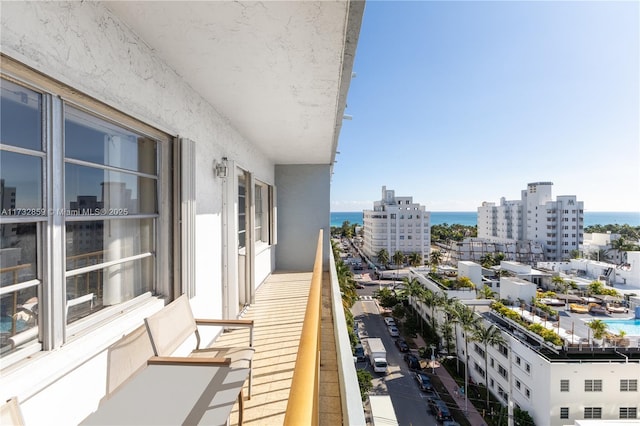 balcony featuring a water view