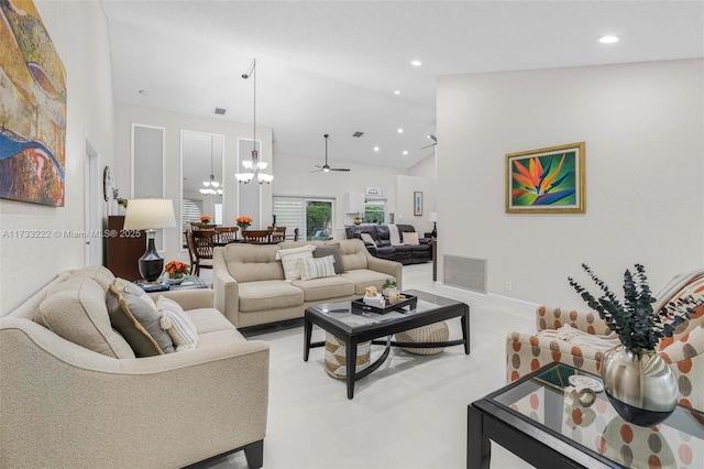 living room with a notable chandelier and high vaulted ceiling