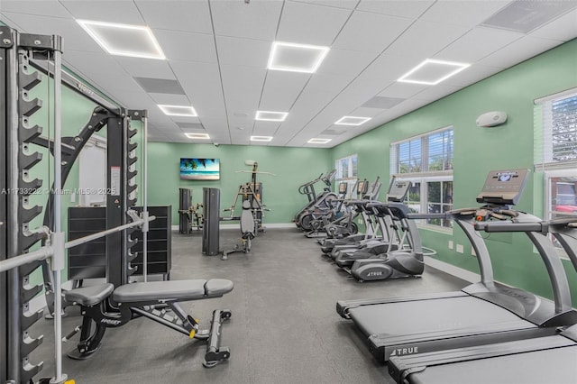 exercise room featuring a paneled ceiling