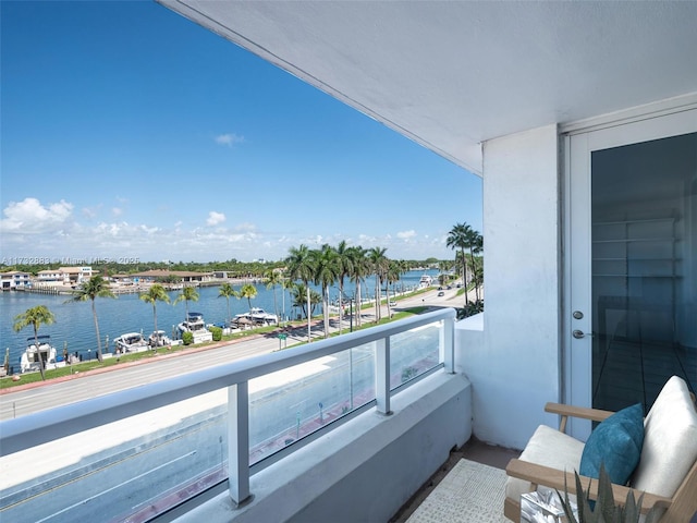 balcony featuring a water view