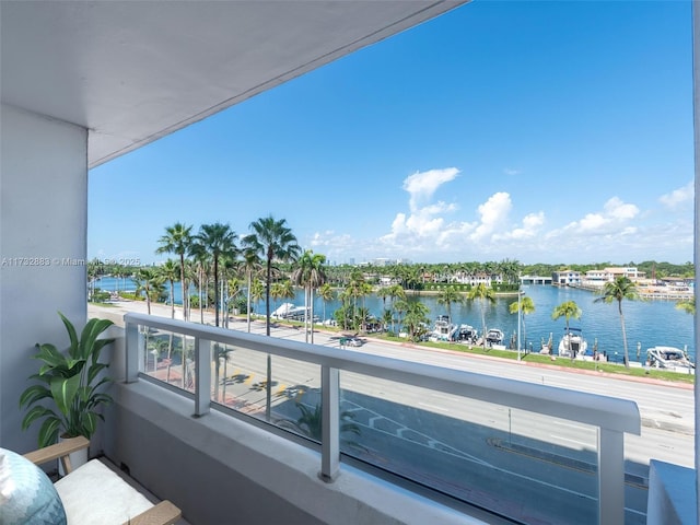 balcony featuring a water view