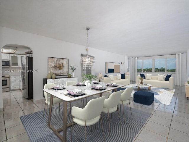 dining area featuring light tile patterned flooring and a notable chandelier