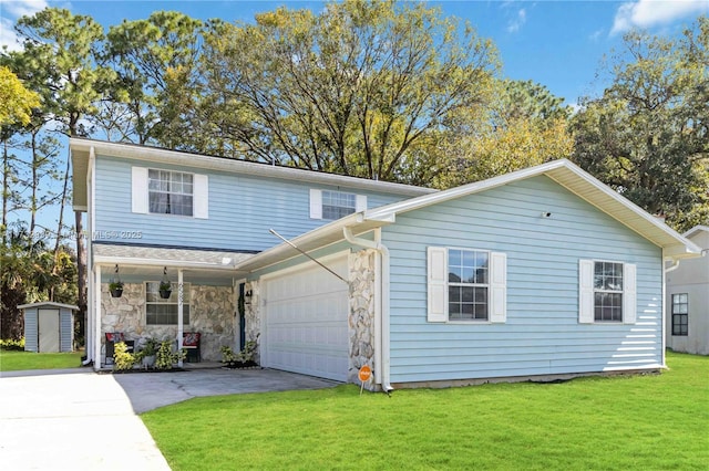 view of front facade with a garage and a front lawn