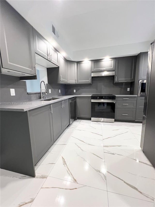 kitchen featuring visible vents, gray cabinets, dishwasher, under cabinet range hood, and electric stove