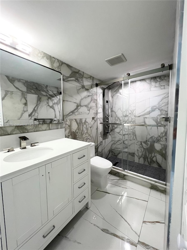 bathroom featuring walk in shower, vanity, and toilet