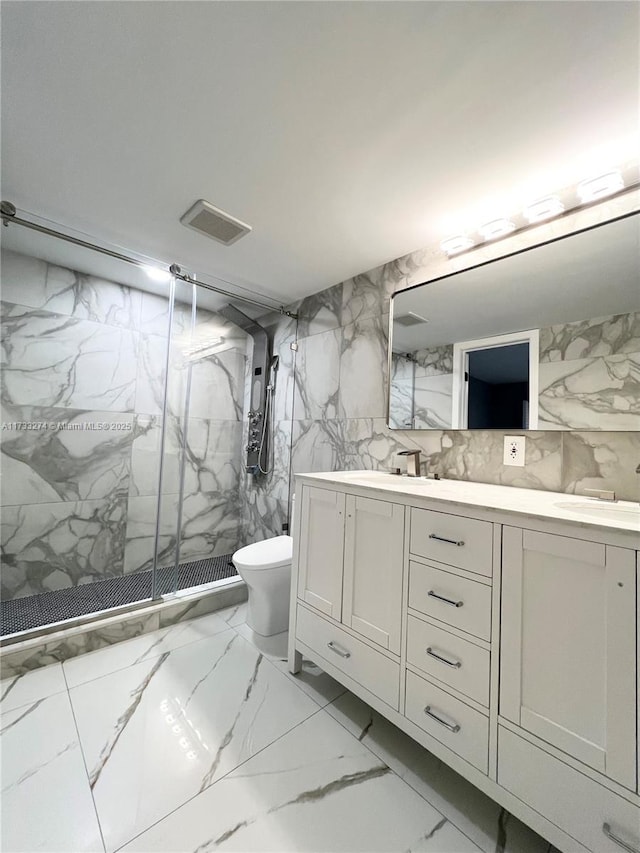 bathroom with an enclosed shower, vanity, toilet, and tile walls