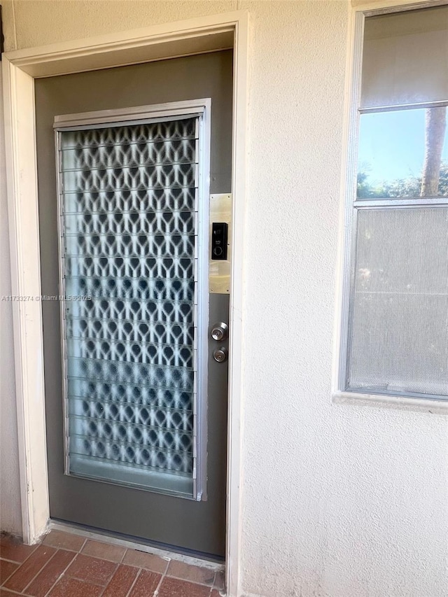 entrance to property featuring elevator