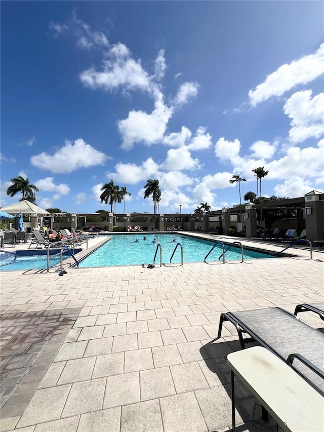 view of swimming pool featuring a patio