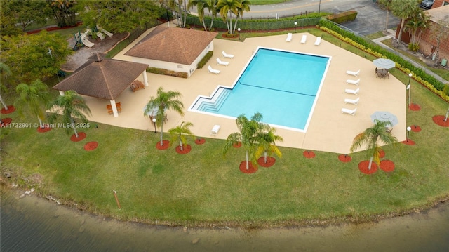 view of pool featuring a gazebo, a yard, and a patio area