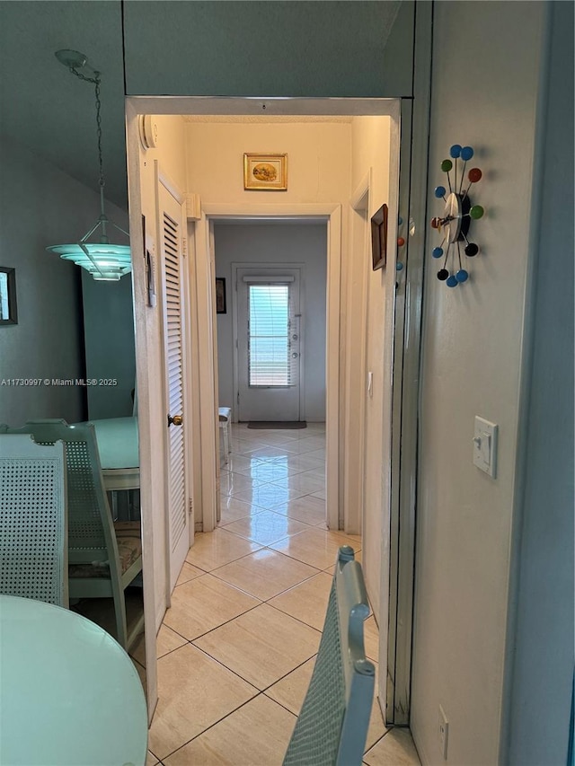 corridor with light tile patterned floors