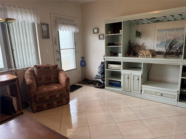 sitting room with light tile patterned flooring