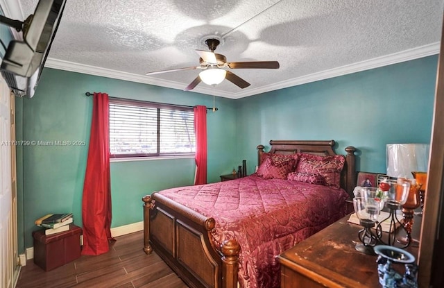 bedroom featuring crown molding, ceiling fan, and a textured ceiling