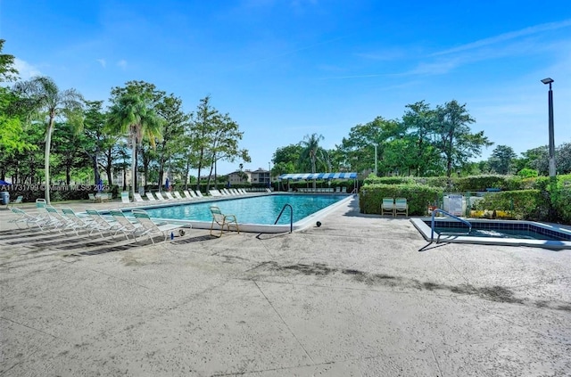 view of swimming pool featuring a patio