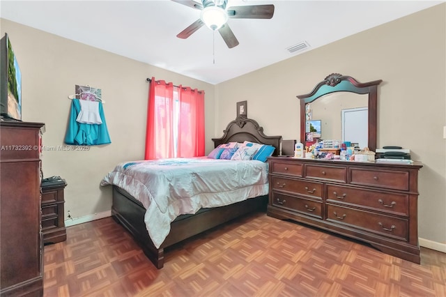 bedroom featuring visible vents, a ceiling fan, and baseboards