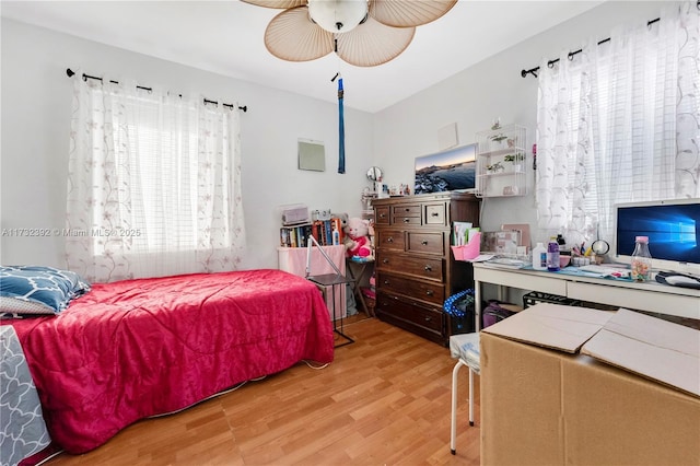 bedroom with light wood-style flooring and ceiling fan