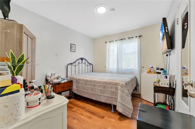 bedroom featuring light wood-style floors