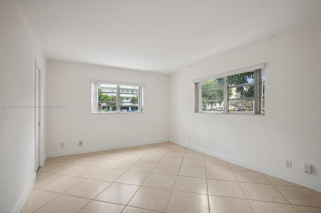 empty room featuring light tile patterned floors