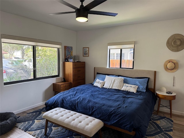 bedroom featuring hardwood / wood-style flooring and ceiling fan