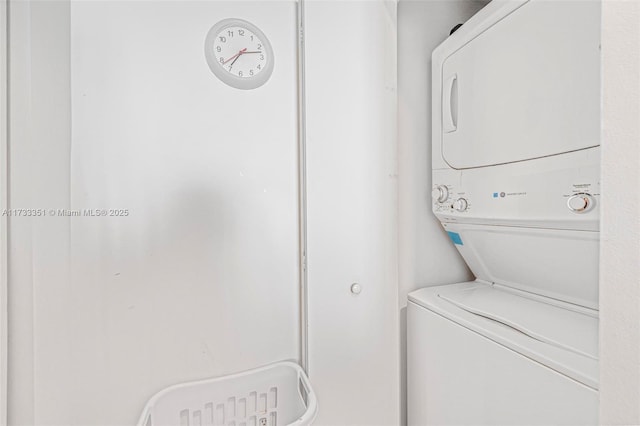 washroom with stacked washer and clothes dryer