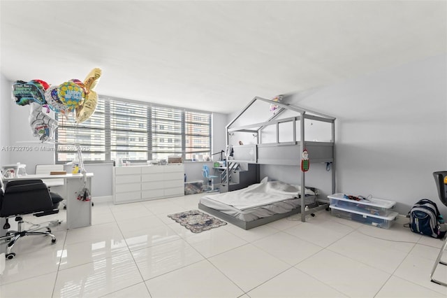 bedroom with light tile patterned floors