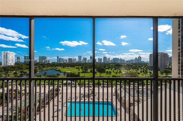 unfurnished sunroom featuring a water view