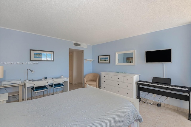 tiled bedroom with a textured ceiling