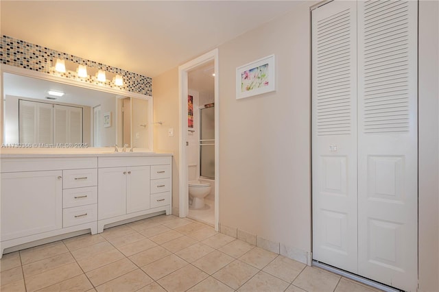 full bathroom featuring vanity, shower / washtub combination, tile patterned floors, and toilet