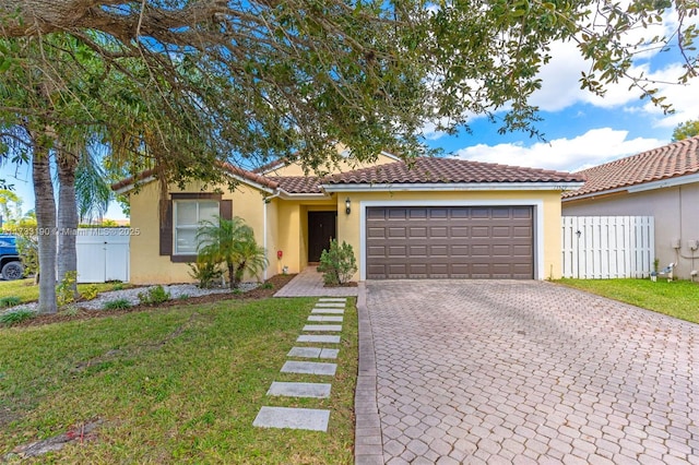 view of front of home featuring a front lawn, decorative driveway, an attached garage, and stucco siding