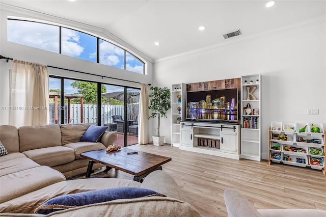 living area featuring ornamental molding, a fireplace, wood finished floors, and recessed lighting