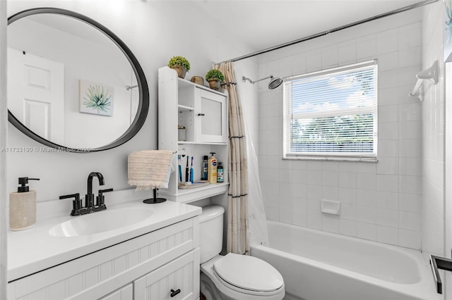 bathroom featuring toilet, shower / tub combo, and vanity