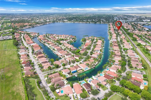 bird's eye view featuring a water view and a residential view