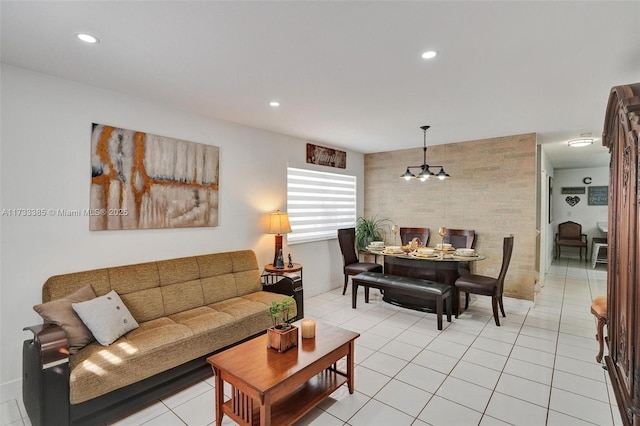 living area featuring light tile patterned floors, an inviting chandelier, and recessed lighting